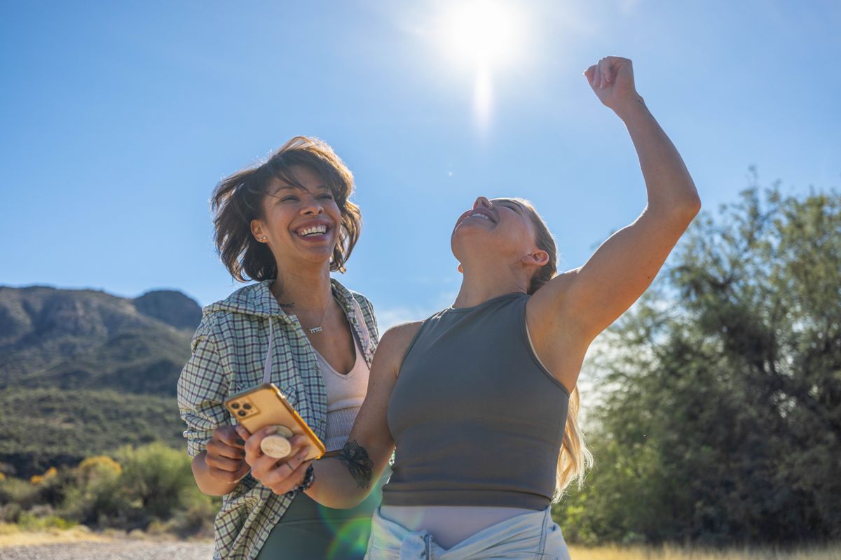 Friends celebrating a summit in the Arizona desert