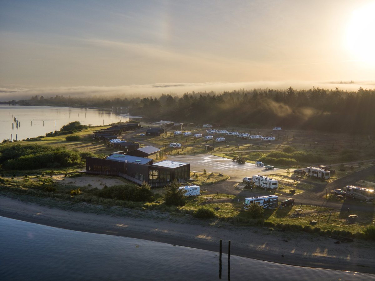 Aerial view of a modern cabin resort on the water