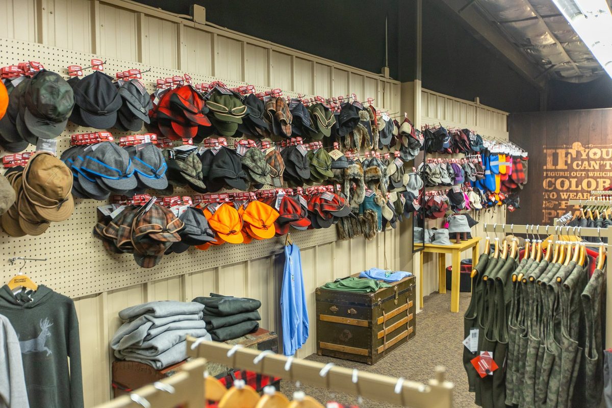 Workers sewing and finishing outdoor apparel on a factory floor