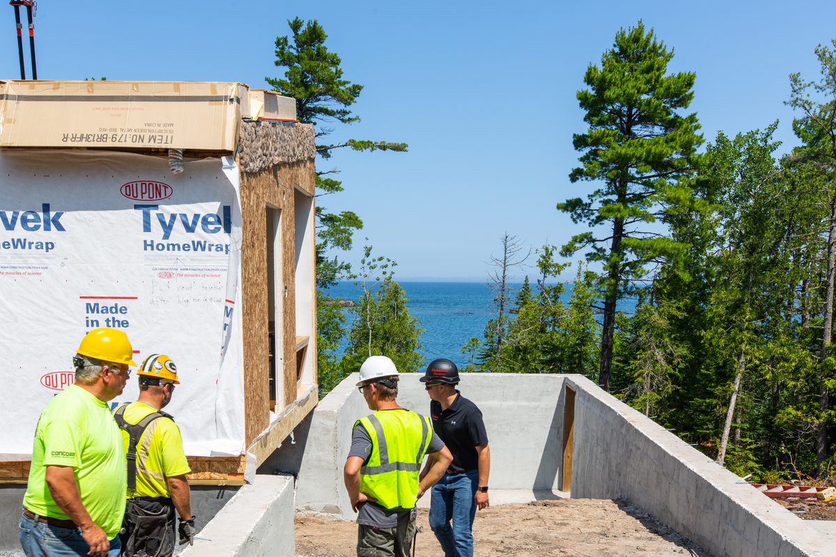 Crane setting a modular home section on build day