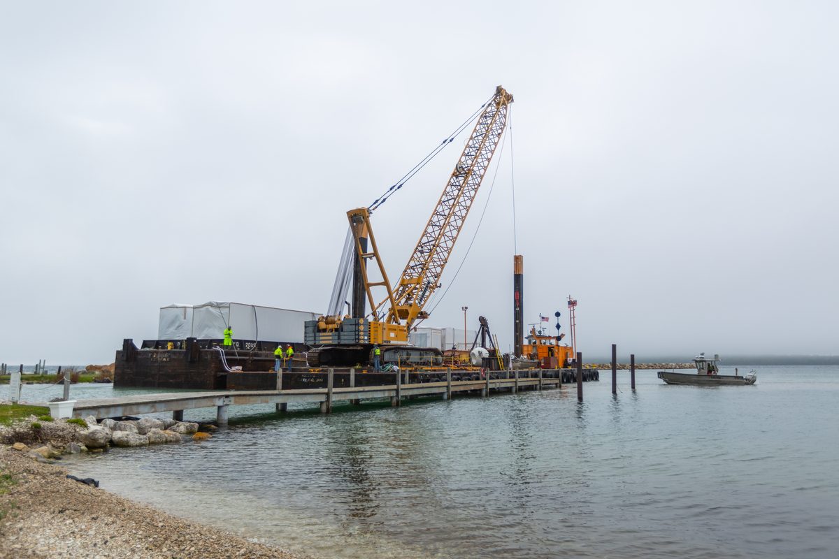 Crane setting a modular home section on build day