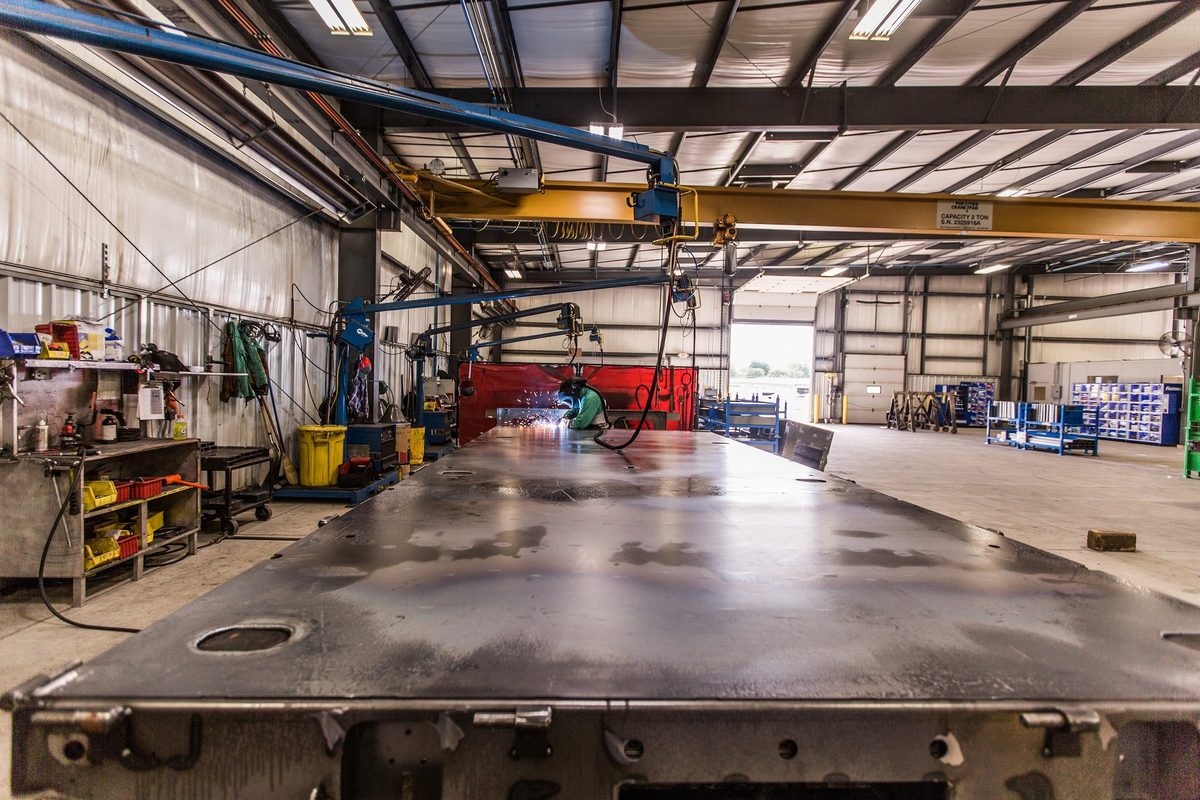 Fabrication and welding inside a truck body manufacturing plant