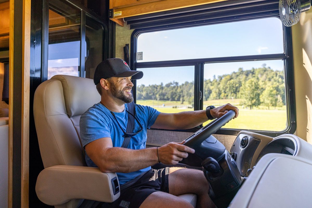 Luxury motorhome on a scenic road, RV lifestyle photography