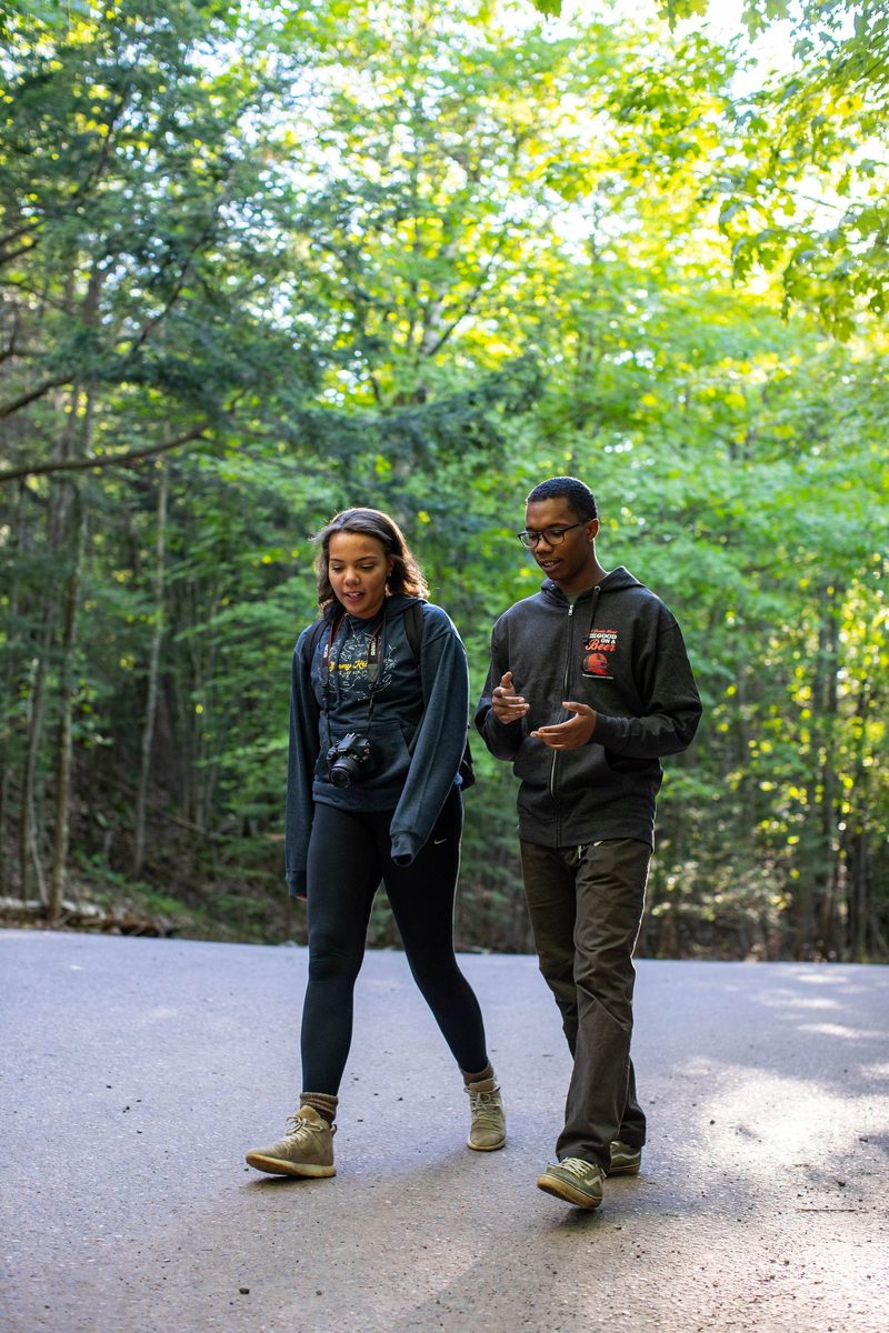Friends outdoors in rugged Northwoods apparel, lifestyle brand photography