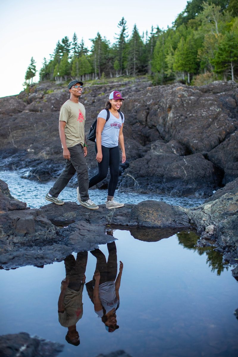 Friends outdoors in rugged Northwoods apparel, lifestyle brand photography
