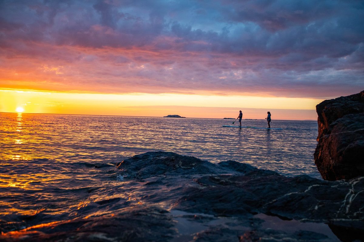 Friends outdoors in rugged Northwoods apparel, lifestyle brand photography