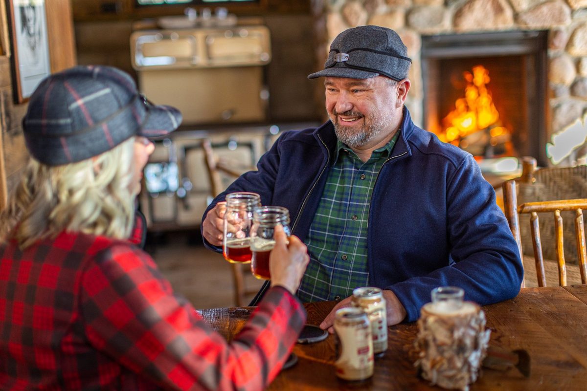Friends outdoors in rugged Northwoods apparel, lifestyle brand photography