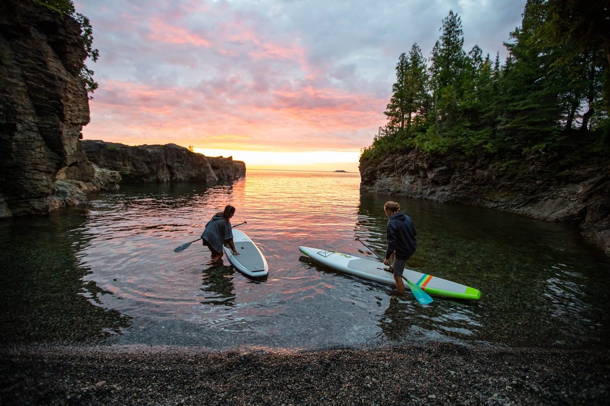 Friends outdoors in rugged Northwoods apparel, lifestyle brand photography