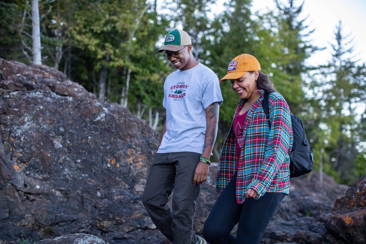 Friends outdoors in rugged Northwoods apparel, lifestyle brand photography