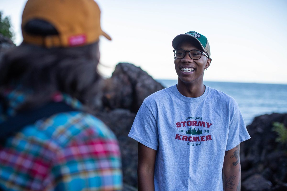 Friends outdoors in rugged Northwoods apparel, lifestyle brand photography