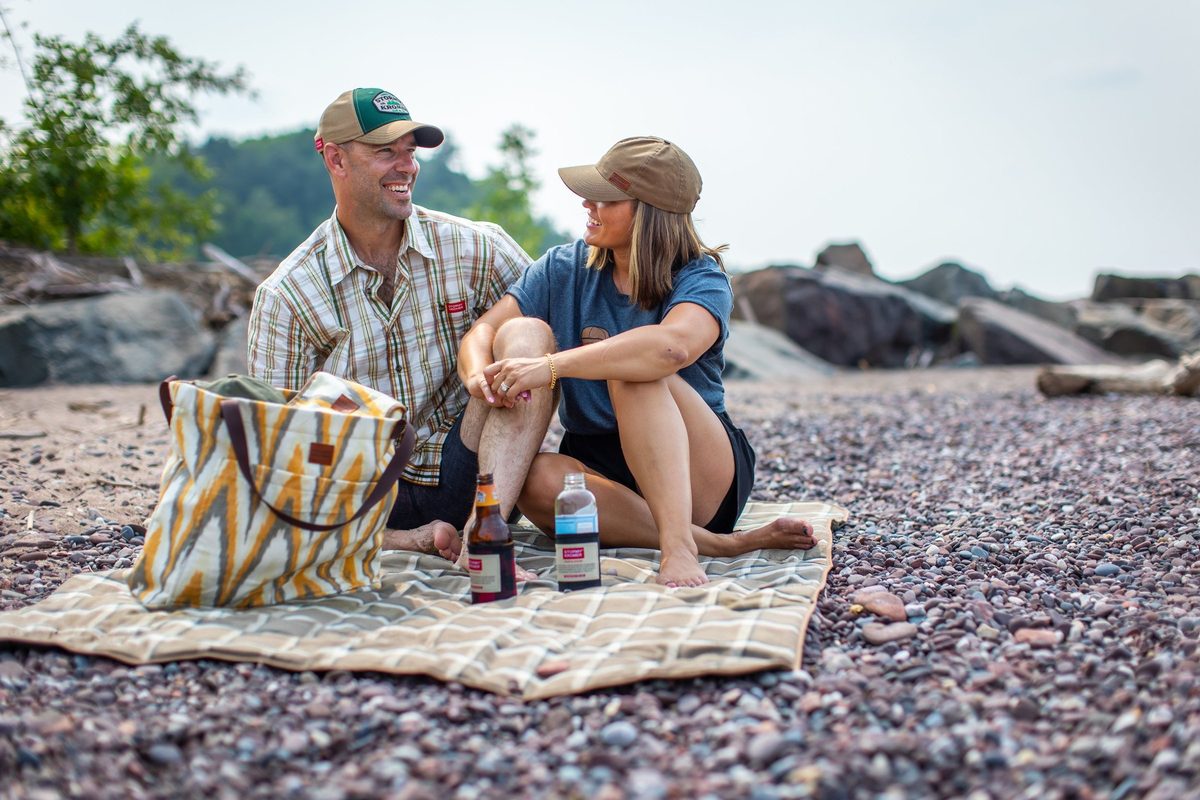 Friends outdoors in rugged Northwoods apparel, lifestyle brand photography