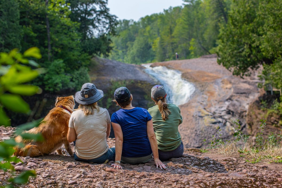 Friends outdoors in rugged Northwoods apparel, lifestyle brand photography