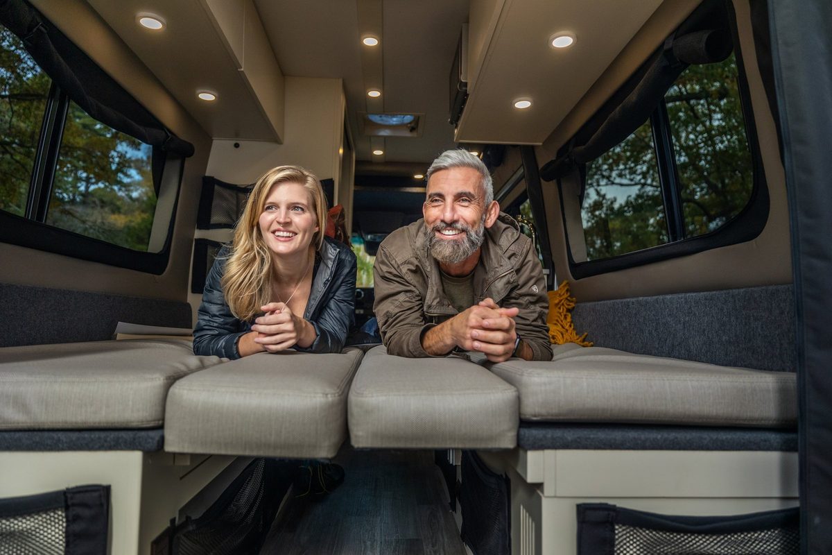 Couple relaxing inside a luxury motorhome