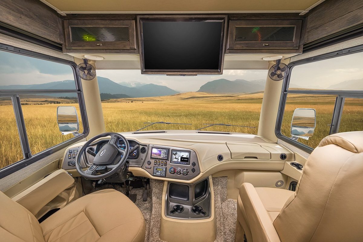 Luxury motorhome interior with kitchen, living area and cabin details