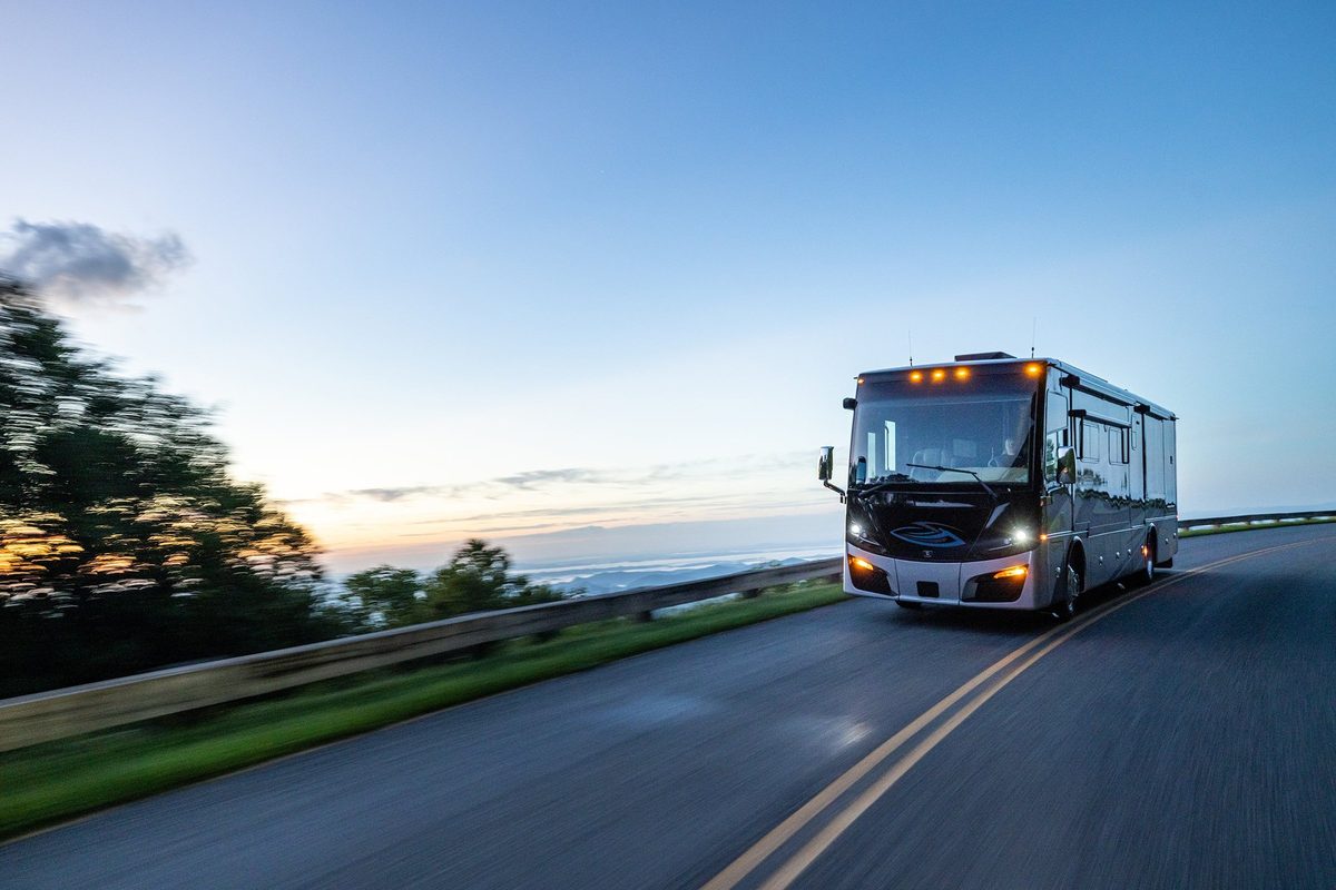 Luxury motorhome on a scenic road, RV lifestyle photography