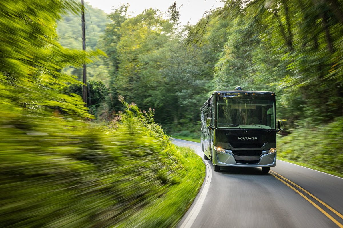 Luxury motorhome on a scenic road, RV lifestyle photography