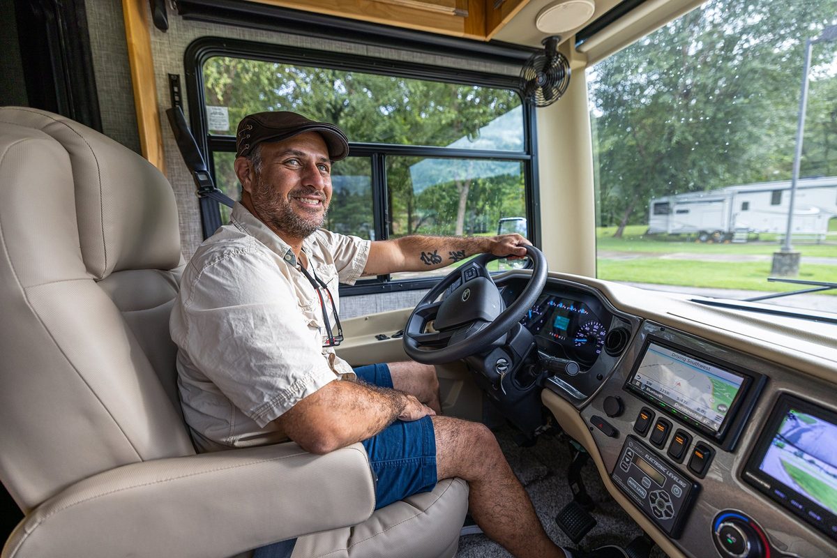 Luxury motorhome on a scenic road, RV lifestyle photography