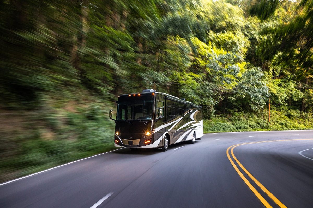 Luxury motorhome on a scenic road, RV lifestyle photography
