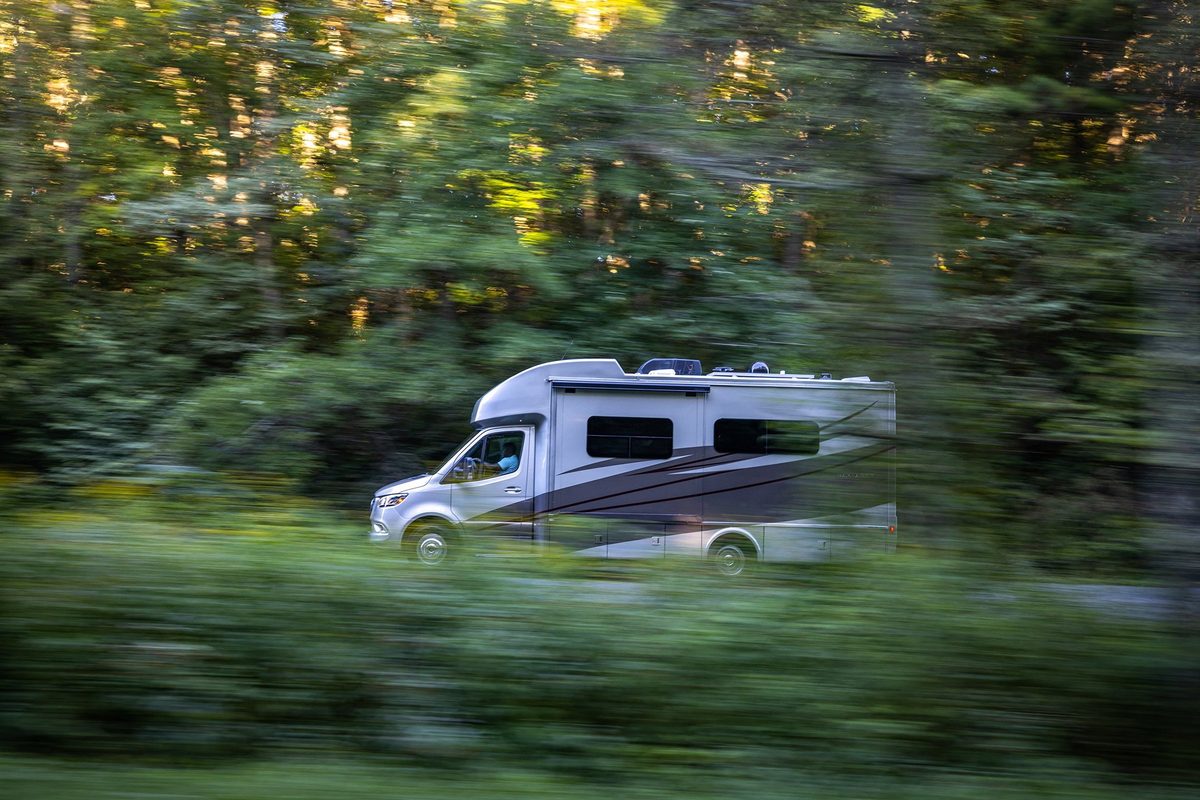 Luxury motorhome on a scenic road, RV lifestyle photography