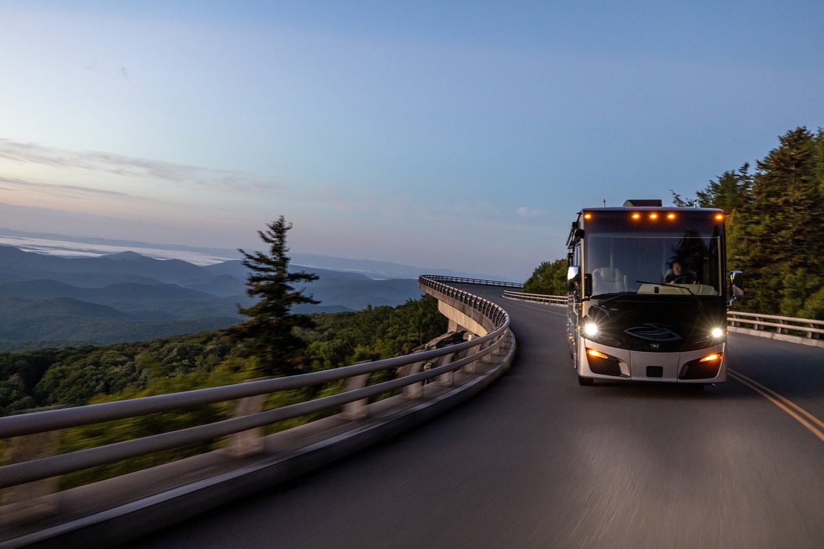 Luxury motorhome on a scenic road, RV lifestyle photography