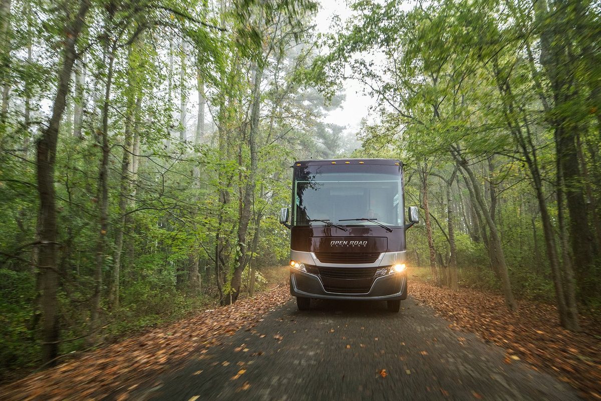 Luxury motorhome on a scenic road, RV lifestyle photography