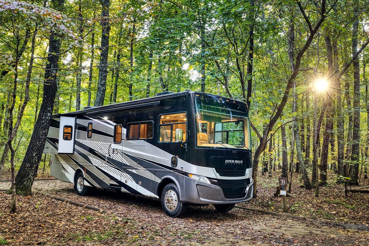 Luxury motorhome on a scenic road, RV lifestyle photography
