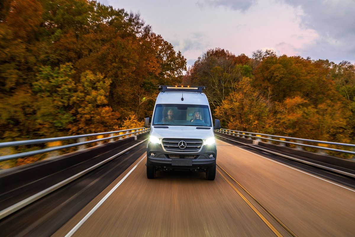 Luxury motorhome on a scenic road, RV lifestyle photography