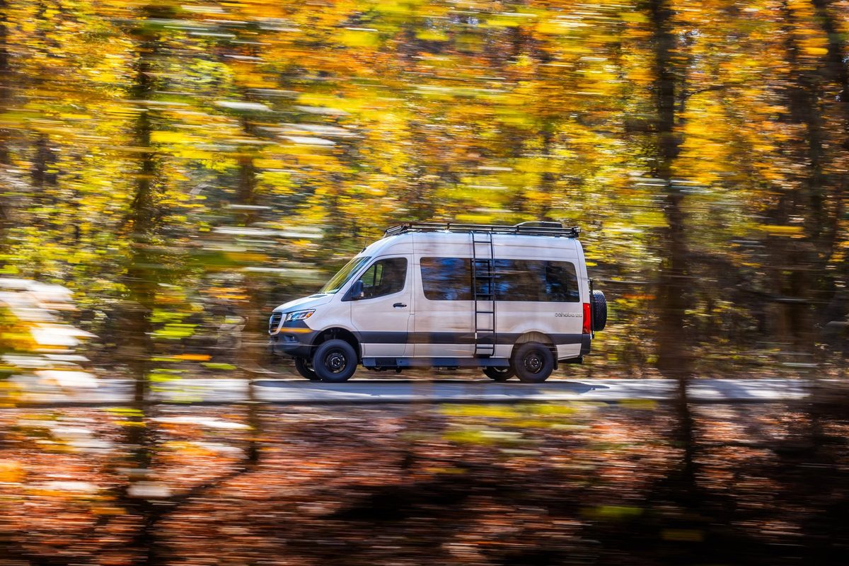 Luxury motorhome on a scenic road, RV lifestyle photography