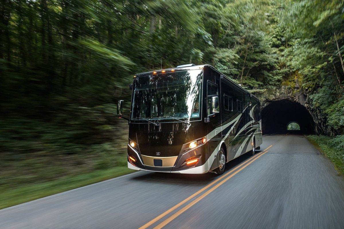 Luxury motorhome on a scenic road, RV lifestyle photography