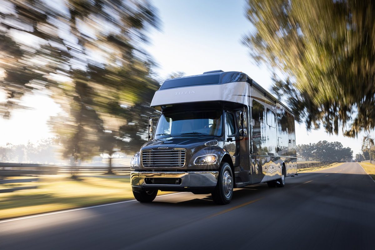 Luxury motorhome on a scenic road, RV lifestyle photography