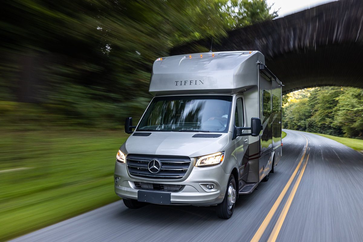 Luxury motorhome on a scenic road, RV lifestyle photography