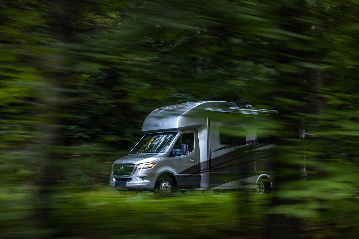 Luxury motorhome on a scenic road, RV lifestyle photography