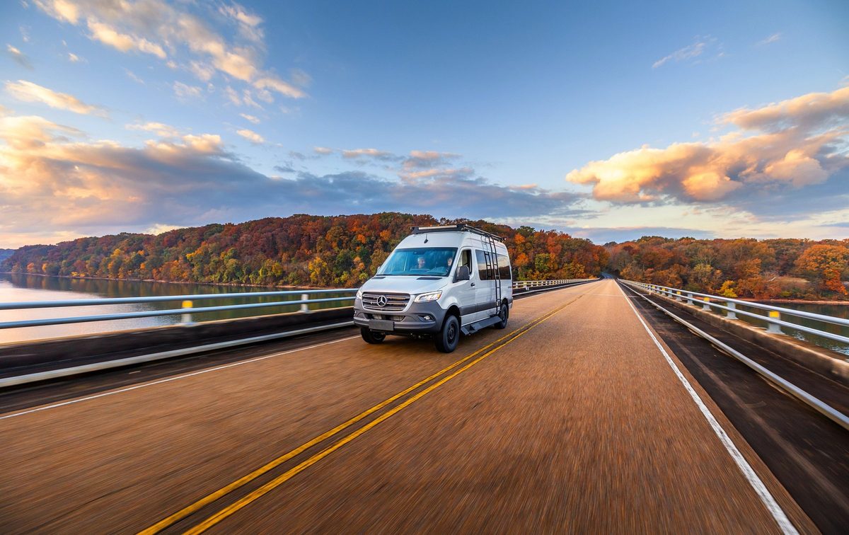 Luxury motorhome on a scenic road, RV lifestyle photography