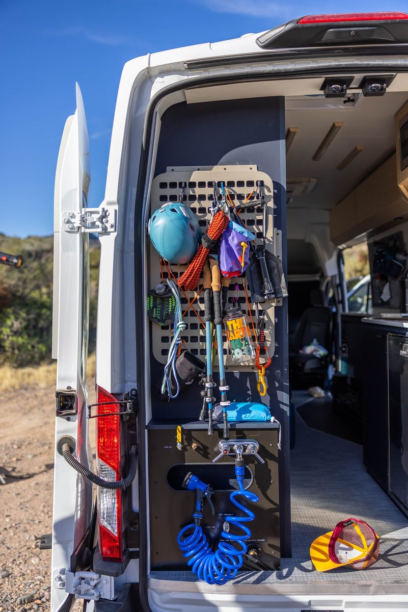 Couple traveling in a camper van on a mountain road trip